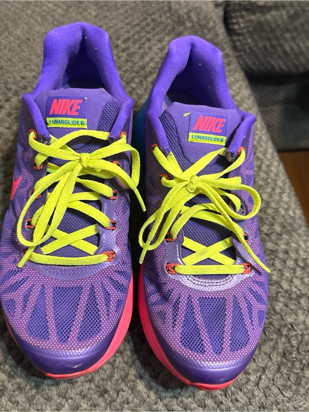 Nike Purple Running Shoes with Neon Yellow Laces and Pink Accents